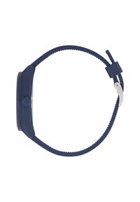 Tumesinine silikoonkell ümarate nägudega, tekstuuriga rihm ja hõbedase värvitooniga pandla. Omab minimalismi disaini ja sileda viimistlusega.