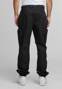Urban Classics RIPSTOPLOOSE FIT  - Trousers - black