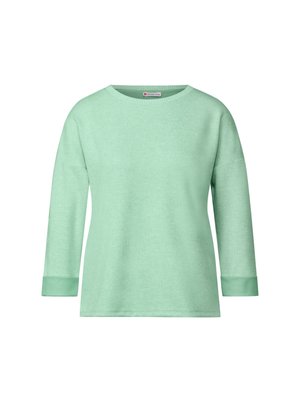 Maglione verde menta chiaro con scollatura rotonda, maniche a tre quarti e maniche con polsini. Tessuto morbido, design semplice, senza motivi o adornamenti.