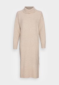 Robe col roulé beige en tissu tricoté doux, dotée de manches longues, d'une coupe décontractée et de détails côtelés à l'ourlet et aux poignets.