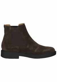 Stivale alla caviglia in suede marrone con pannelli elastici ai lati, punta rotonda e suola in gomma nera con battistrada testurizzato per una migliore aderenza.