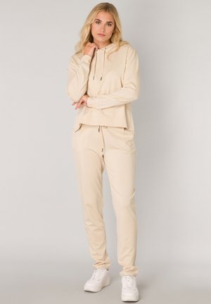 BASE LEVEL - Tracksuit bottoms - light beige