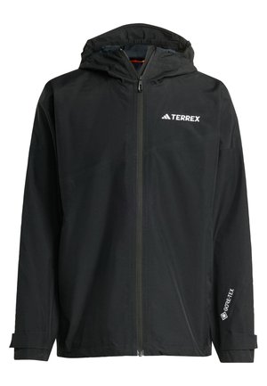 Veste imperméable noire avec capuche, fermeture éclair à l'avant et poignets ajustables. Dispose d'accents de logo et d'une étiquette GORE-TEX sur la manche.