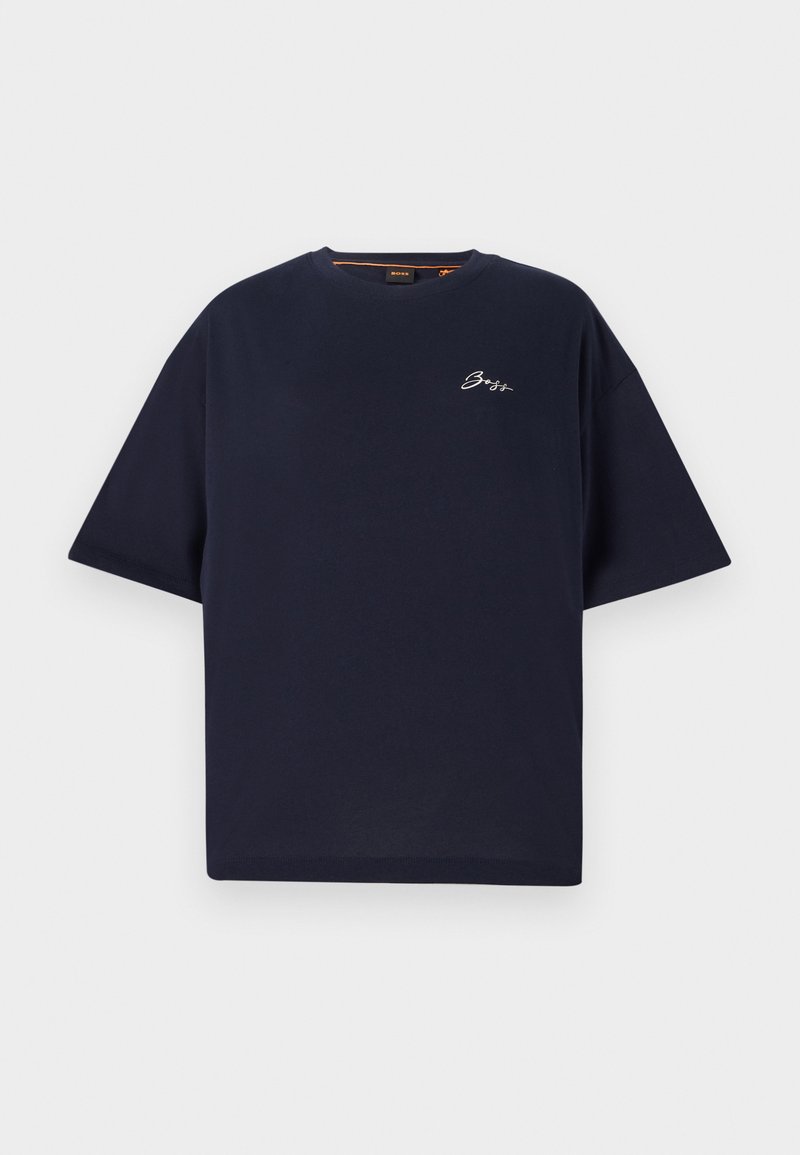 T-shirt oversize marine en coton, avec des manches courtes et un col rond. Un petit logo brodé blanc est positionné sur la poitrine.