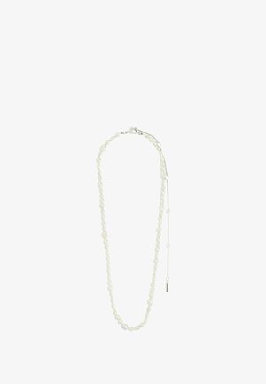 White pearl necklace with an alternating oval and round bead design, featuring a silver lobster clasp and an adjustable chain extender.