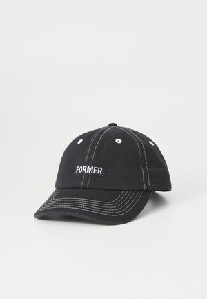 Black cotton cap with white stitching, curved brim, and a rectangular "FORMER" tag on the front. Features six ventilation holes.