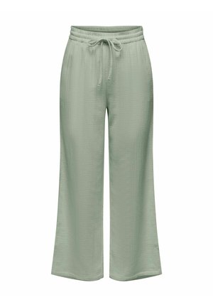 Světle zelené kalhoty s širokými nohavicemi, elastickým pasem a předním šňůrkováním, vyrobené z texturované látky.
