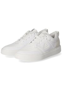 White athletic shoes with a smooth leather upper, lace closure, and textured rubber soles; features a small logo and contrasting accents.