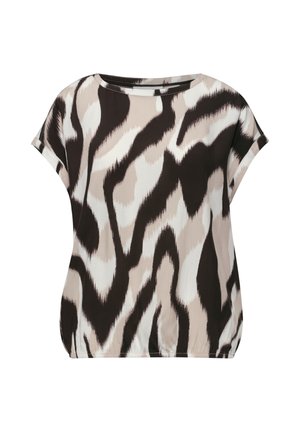 Blouse à manches courtes, coupe ample avec motif animalier abstrait noir, beige et blanc sur tissu lisse.