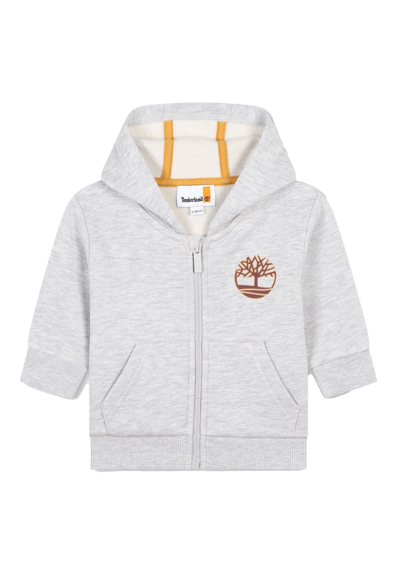 Felpa grigia con zip, dotata di cappuccio foderato, tasche frontali, polsini e orlo a costine. Presenta un logo alberato ricamato marrone sul petto.