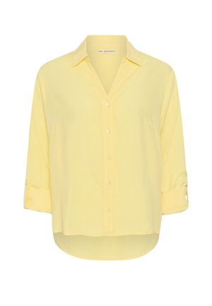 Blouse ample jaune pâle boutonnée avec manches retroussées trois-quarts et col pointu, marque Love Copenhagen.