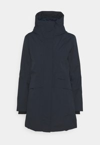 Navy waterproof parka jacket with a high collar, front pockets, and elastic cuffs. Features a minimalist design and no visible hardware.