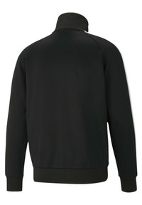 Giacca a track nera con colletto alto, polsini e orlo a coste. Tessuto liscio, senza modelli o accessori visibili, caratterizzata da un design minimalista.