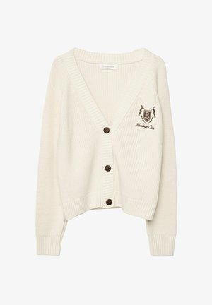 Cardigan tricoté couleur crème avec un col en V, des poignets et un ourlet côtelés. Dispose de boutons marron et d'un logo brodé sur le côté gauche.