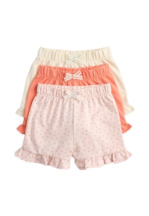 Drei Paar Kinderkurzshorts in Rosa mit kleinen Punkten, Koralle und Creme, alle mit elastischem Bund und kleinen dekorativen Schleifen.