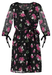 Svart omlottklänning med långa genomskinliga ärmar, prydd med rosa och vita blommönster. Snörning i midjan för justerbar passform. Lättviktsmaterial.