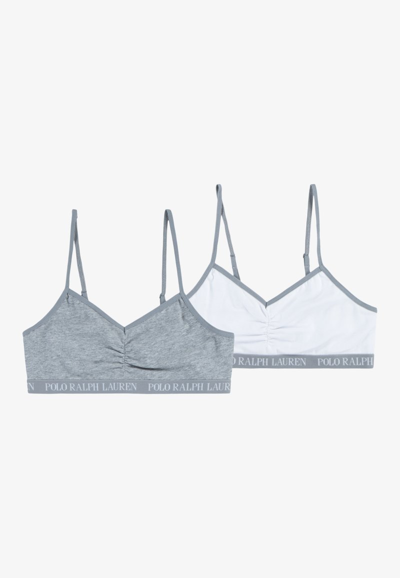 Dve bralette, ena siva z nabranim središčem, druga pa bela. Obe imata tanke naramnice in sivo elastično pasico z logotipom.