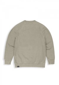 Light beige crewneck sweatshirt with raglan sleeves, textured fabric, ribbed cuffs, and hem. Features a small brand label on the lower hem.