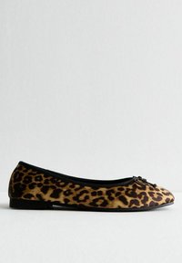 Leopard print flat shoe with a soft, velvety texture, black trim along the opening, and a decorative bow accent on the front.