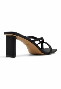 Black heeled sandals with a chunky rectangular heel, thin crisscross straps, and a smooth, matte finish on the upper and insole.