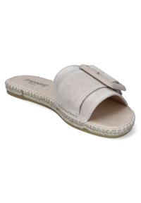 Slide sandal in light grey suede with a wide band and decorative accent, featuring a woven jute trim and flat sole for comfort.