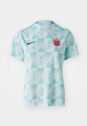 Light blue short-sleeved jersey with a geometric diamond pattern. Features a navy Nike swoosh and a gold-bordered national team crest.