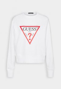 Sweat-shirt blanc à manches longues avec un logo triangle rouge et un texte noir "GUESS U.S.A." avec "WASHED JEANS" et un point d'interrogation rouge à l'intérieur.