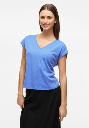 Blue V-neck t-shirt with short sleeves, made from a textured fabric. The shirt has a relaxed fit and falls slightly below the waist.