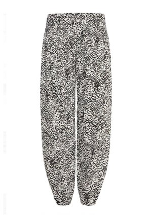Sort og hvid mønstret bukser med løs pasform, elastisk talje og samlede manchetter. Har et abstrakt design med varierende teksturer.
