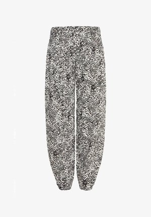 Sort og hvid mønstret bukser med løs pasform, elastisk talje og samlede manchetter. Har et abstrakt design med varierende teksturer.