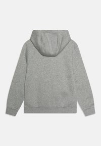 Šedá bavlněná mikina s prostornou kapucí, žebrovanými manžetami a lemem. Design je jednoduchý, bez dalších vzorů či akcentů.