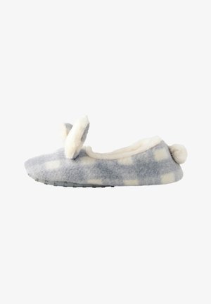 Chausson doux à carreaux gris et blanc avec des oreilles de lapin duveteuses sur le dessus et une queue en pompon au talon.