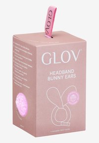 Ljusrosa låda med en grafik av ett kaninöron-huvudband. Designen inkluderar vit text och en accentcirkel som säger "mjukt fiber".