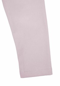 Jasnoróżowa bawełniana dzianina na legginsy o miękkiej fakturze, z prostym krojem i przeszyciem na dole nogawki przy kostce.