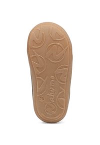 Rubber shoe sole with a textured beige surface, featuring a circular pattern and logo detail. Sturdy and flexible design for traction.