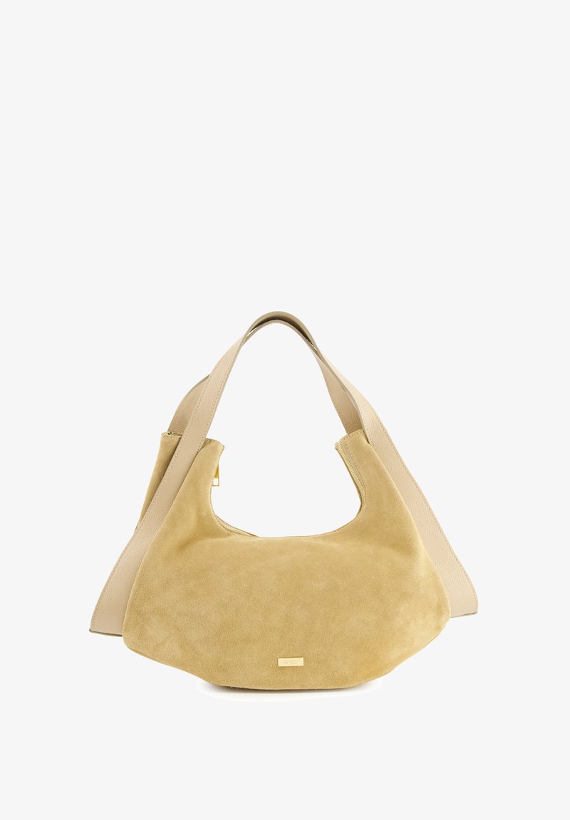 Beige suede håndtaske med et glat læderhank. Buet silhuet, stor åbning. Detaljer i guldfarvet metal foran. Blød tekstur.