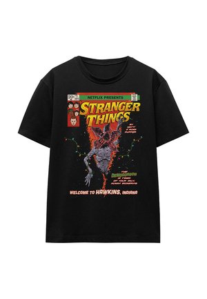 Black cotton t-shirt featuring a colorful graphic print of the Demogorgon, with text "Stranger Things" and "Welcome to Hawkins, Indiana."