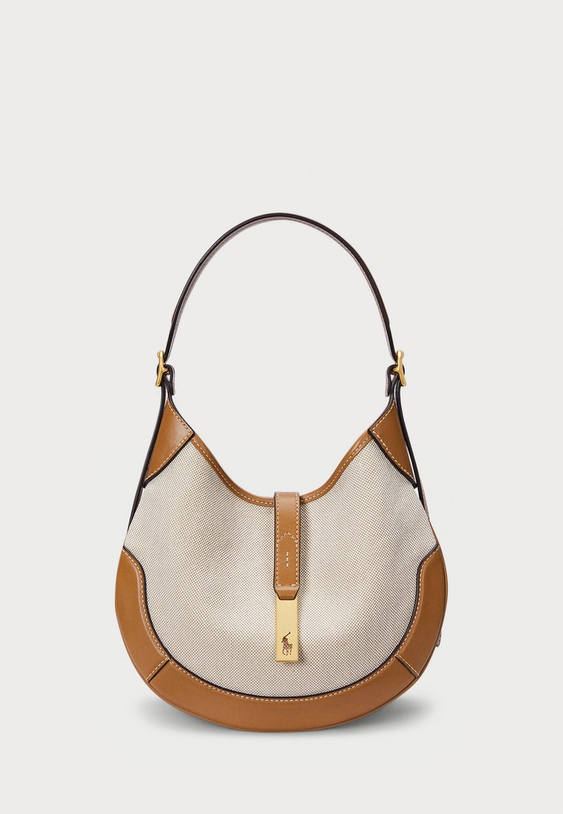 Malinha hobo com base e alça em couro castanho, corpo em canvas creme, detalhes em dourado e uma aba central com o logótipo.