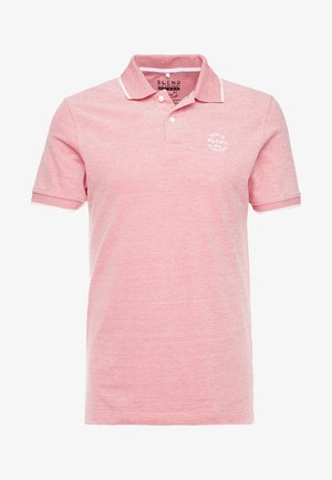 Polo shirt rosa realizzata in tessuto testurizzato, con un piccolo logo bianco sul petto, colletto bianco a contrasto e finiture delle maniche bianche.