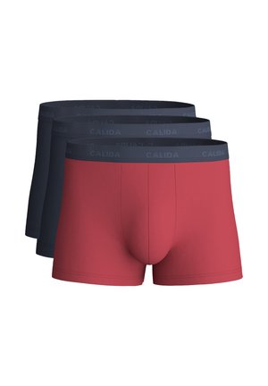 Three men's boxer briefs stacked, one red pair in front and two dark blue pairs behind, all with dark elastic waistbands labeled "CALIDA."