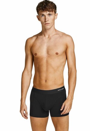 Boxers en coton extensible noir avec une taille douce, arborant un logo, un design ajusté et des coutures contrastantes. Idéaux pour un usage quotidien.