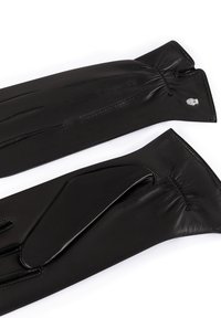 Schwarze Lederhandschuhe mit glatter Textur, die an den Handgelenken geraffte Details und dezente Nähte aufweisen. Beinhaltet ein kleines Metalllogo-Highlight.