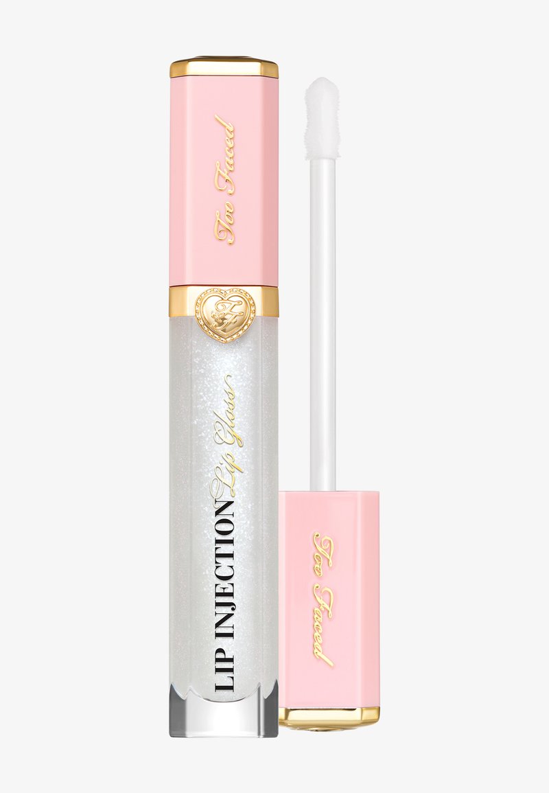 Gloss à lèvres avec une texture claire et pailletée dans un contenant cylindrique, avec un couvercle rose et des accents dorés ; applicateur inclus.