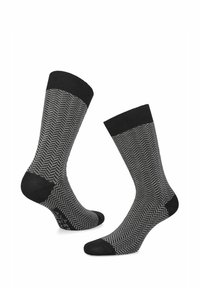 Skarpety w wzór jodełki w kolorze czarnym i szarym. Posiadają czarny ściągacz oraz gładkie czarne akcenty na palcach i piętach. Wykonane z miękkiego materiału.