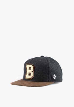 Black felt cap with a brown suede visor, featuring an ivory 'B' appliqué and logo patch on the side. Structured crown design.