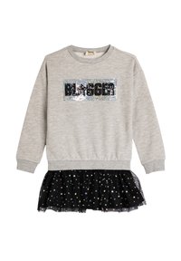 Felpa di cotone grigia con un patch in paillettes nere con la scritta "BLOGGER". Presenta una gonna di tulle nera con ruffles decorata con motivi a stella metallici.