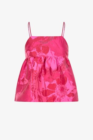 Rožinis rankovių neturintis viršus su plonomis petnešėlėmis, puoštas blizgiu gėlių raštu ir su suglebusia, platėjančia juosmens linija.