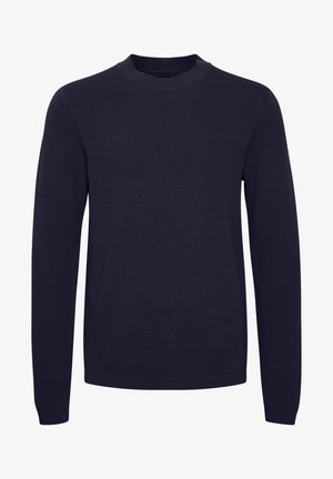 Navy blue knitted sweater with a ribbed texture, round neck, and long sleeves. Features a simple design with no visible patterns or graphics.