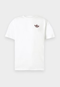 Balta kokvilnas T-kreklu ar bordo izšūtu Adidas logo kreisajā krūtī. Īsas piedurknes un klasiskā apaļā kakla dizains.