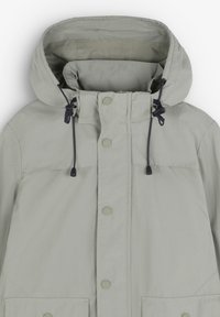 Lichtgrijze hoodie met een voorzijde ritssluiting en drukknoopsluitingen, uitgerust met een verstelbare trekkoordkap en twee grote voorzakken.